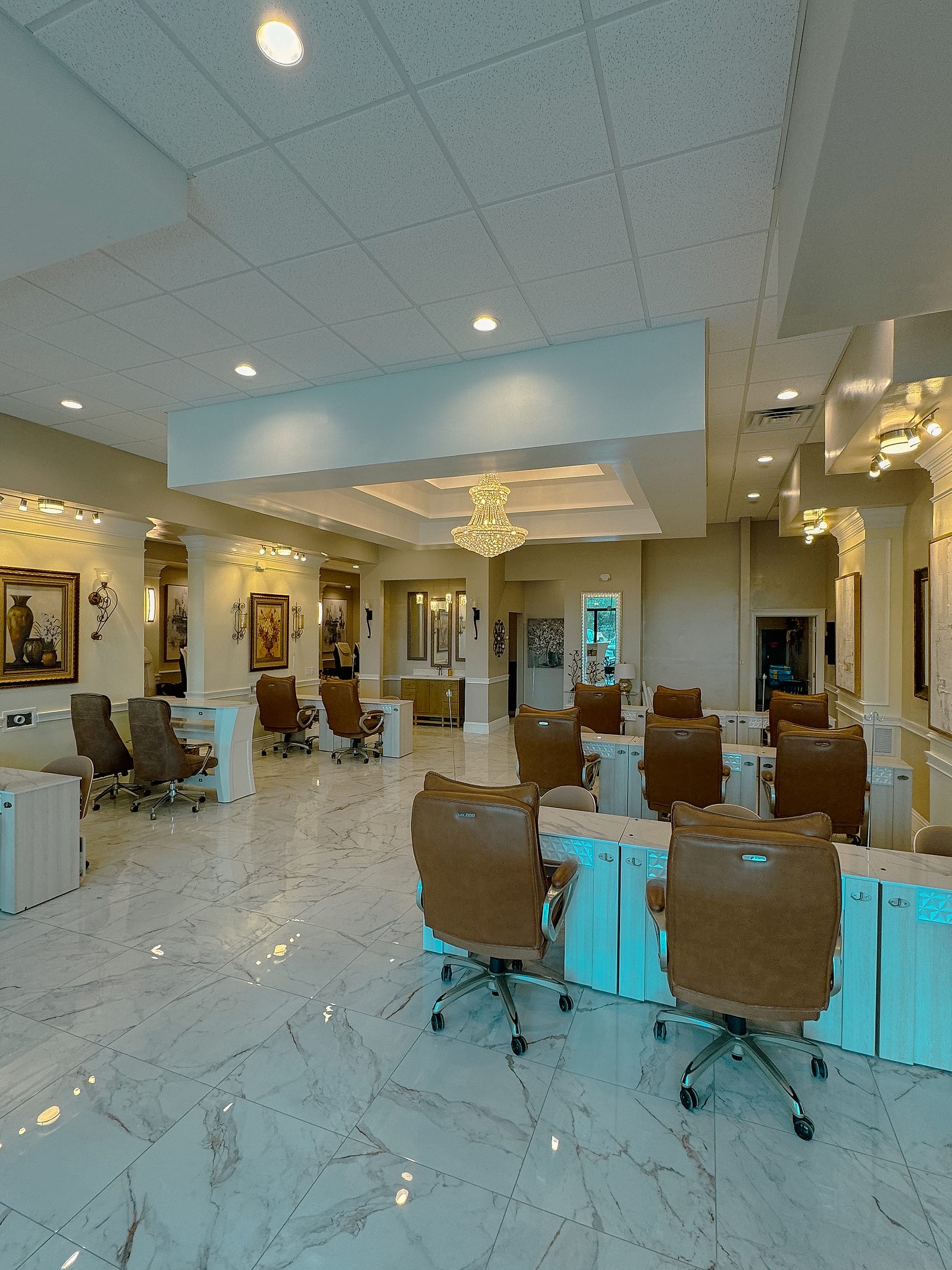 Elegant manicure stations and crystal chandelier at Palace Nail Spa in Midtown Tallahassee