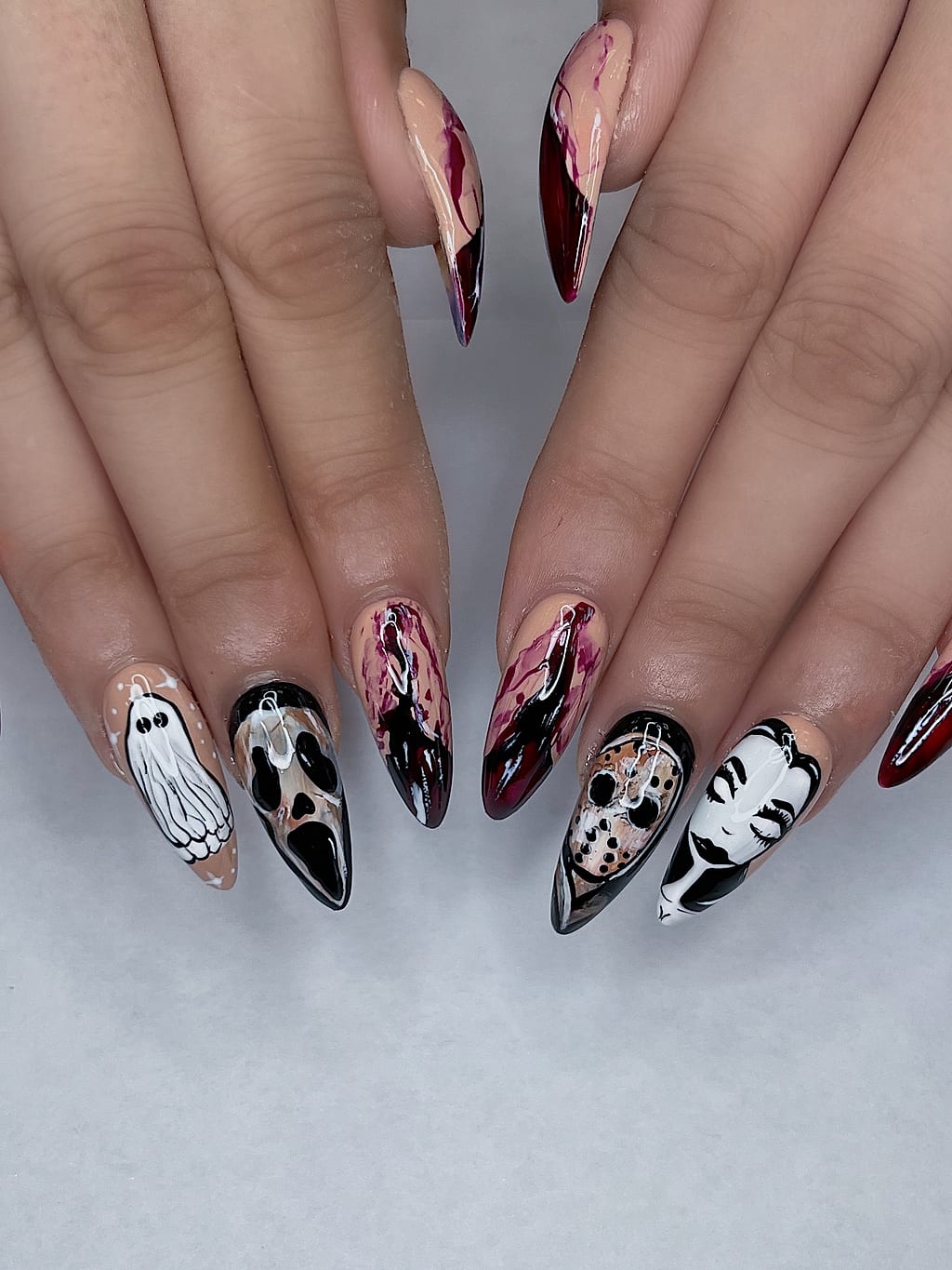 Halloween freehand nail art with hand-painted characters at Palace Nail Spa in Midtown Tallahassee