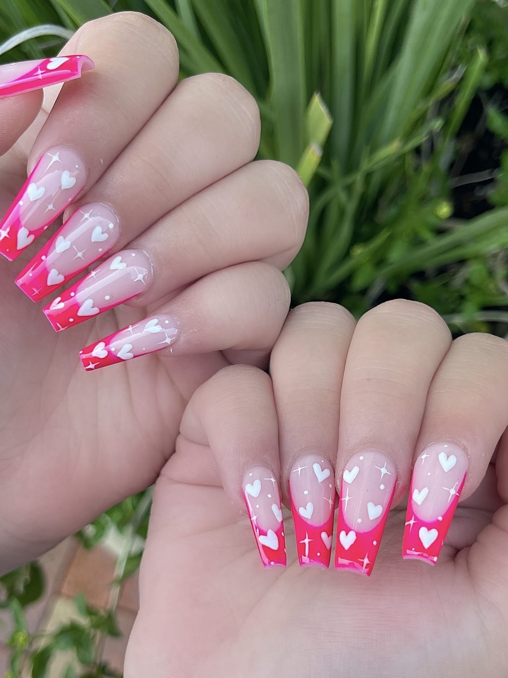 Pink and white coffin nails with ombre hearts at Palace Nail Spa in Midtown Tallahassee