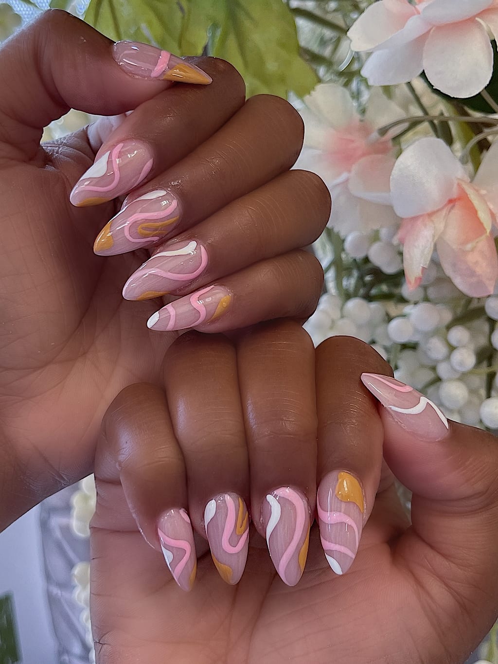 Nude and white swirl nails with gold accents at Palace Nail Spa in Midtown Tallahassee