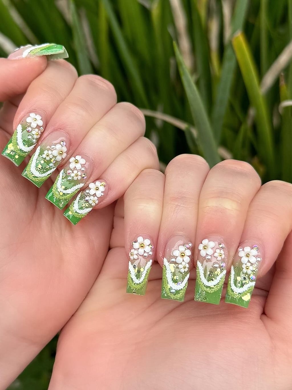 Green ombre coffin nails feature white 3D flowers at Palace Nail Spa in Midtown Tallahassee