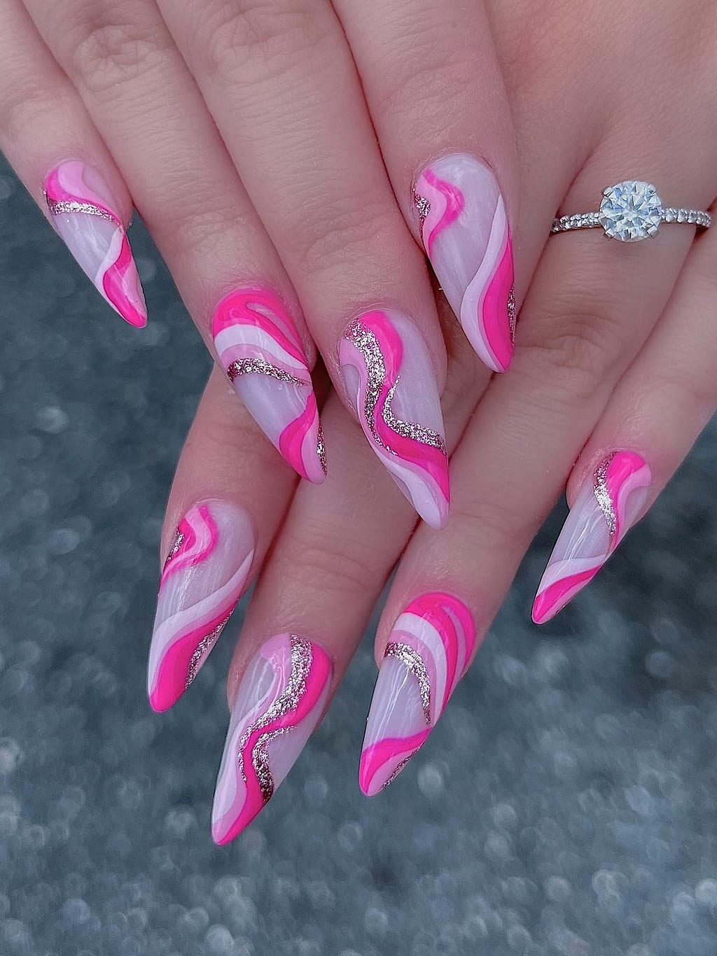 Pink and white coffin nails feature swirled marble art at Palace Nail Spa in Tallahassee