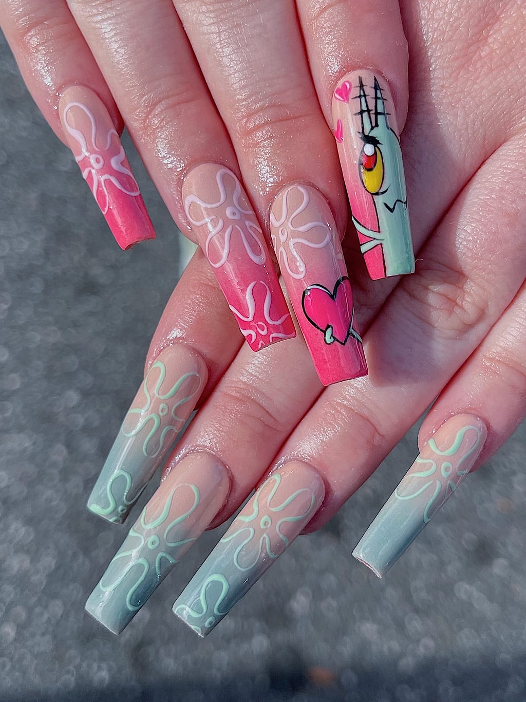 Green ombre coffin nails feature white floral line art at Palace Nail Spa in Midtown Tallahassee