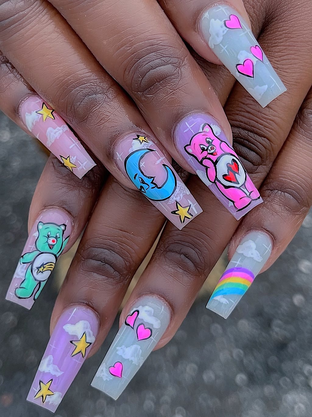 Lavender coffin nails with cartoon bears and rainbow accent at Palace Nail Spa in Midtown Tallahassee