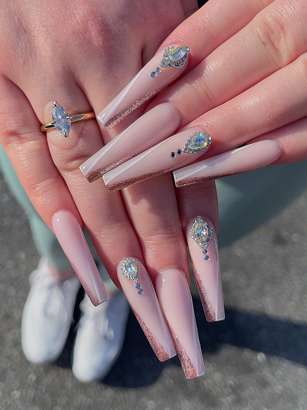 Long nude coffin nails with subtle glossy sparkle finish at Palace Nail Spa in Midtown Tallahassee