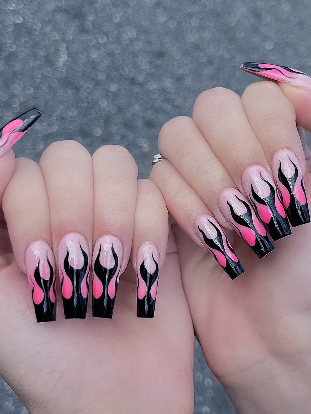 Pink and black coffin nails with flame tip design at Palace Nail Spa in Midtown Tallahassee