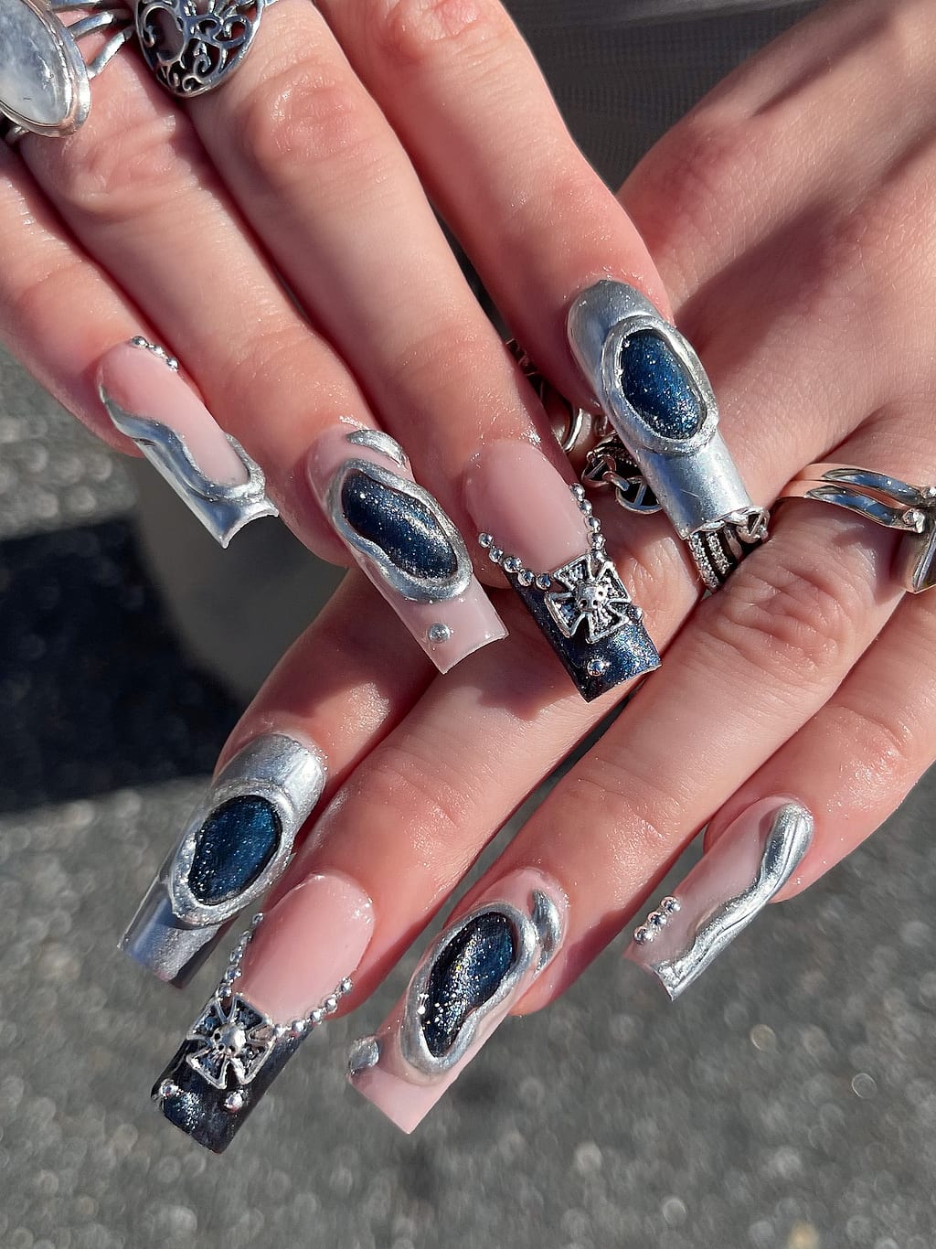 Nude coffin nails with black marble and silver glitter at Palace Nail Spa in Midtown Tallahassee