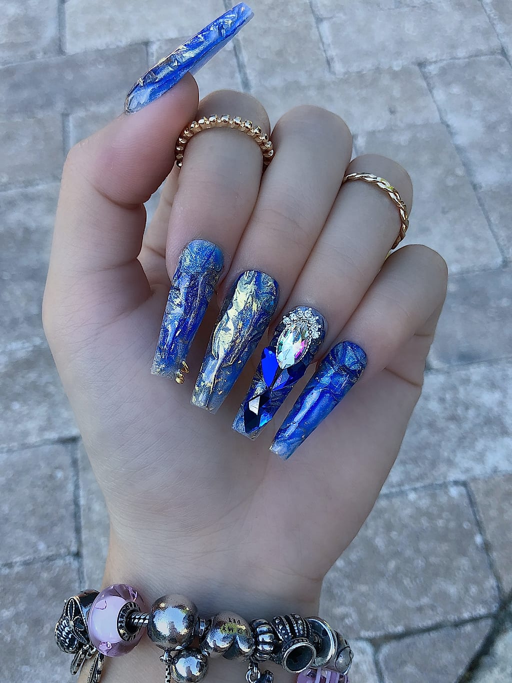 Nude nails with blue marble and crystal chrome accents at Palace Nail Spa in Tallahassee