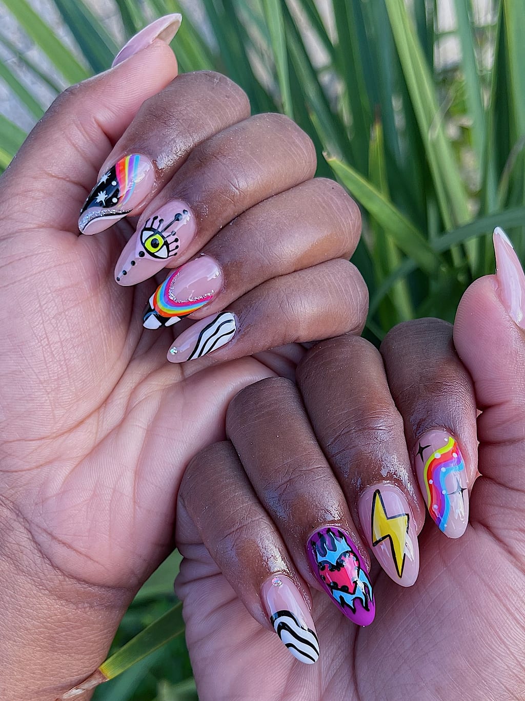 Nude almond nails with colorful freehand line art and doodles at Palace Nail Spa in Tallahassee