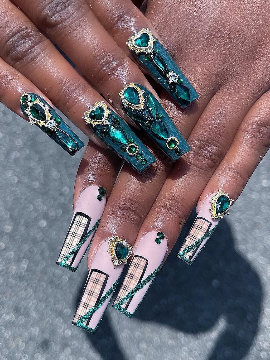 Teal marble coffin nails with a black plaid accent at Palace Nail Spa in Midtown Tallahassee