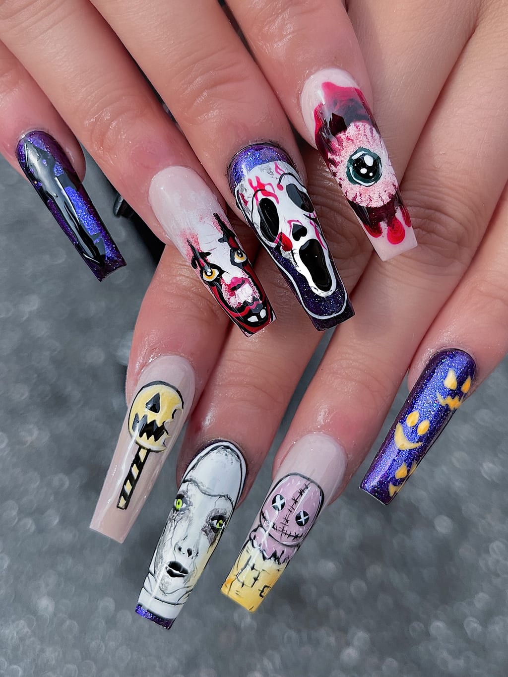 Black and nude coffin nails with Halloween skull art at Palace Nail Spa in Midtown Tallahassee