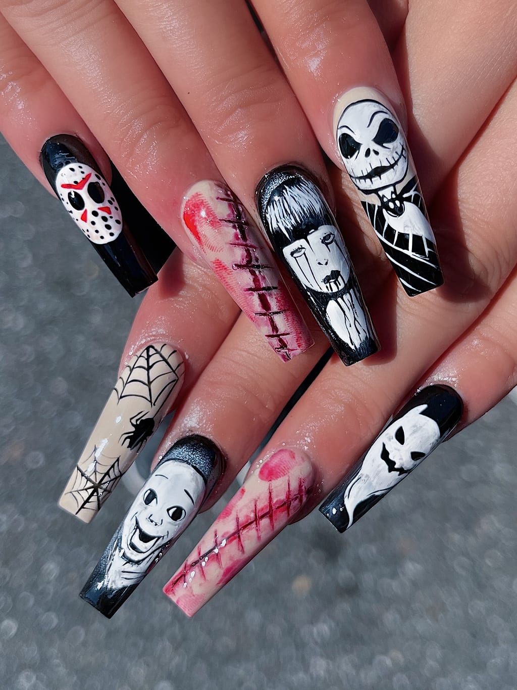 Black and white coffin nails with Halloween skull art at Palace Nail Spa in Midtown Tallahassee