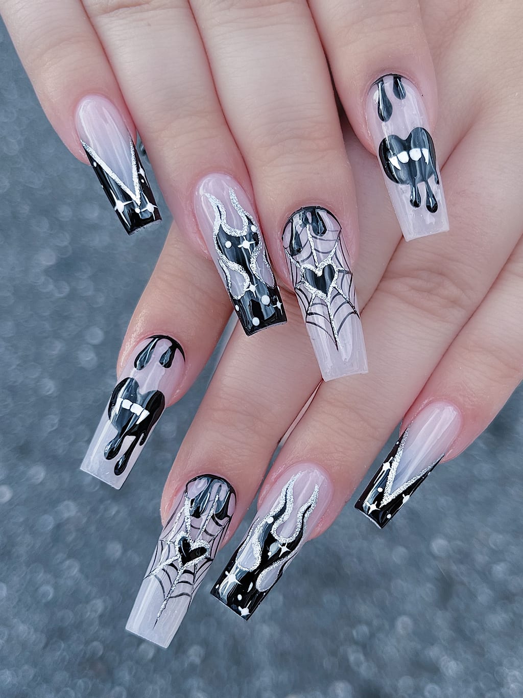 Black and white coffin nails with gothic heart designs at Palace Nail Spa in Midtown Tallahassee
