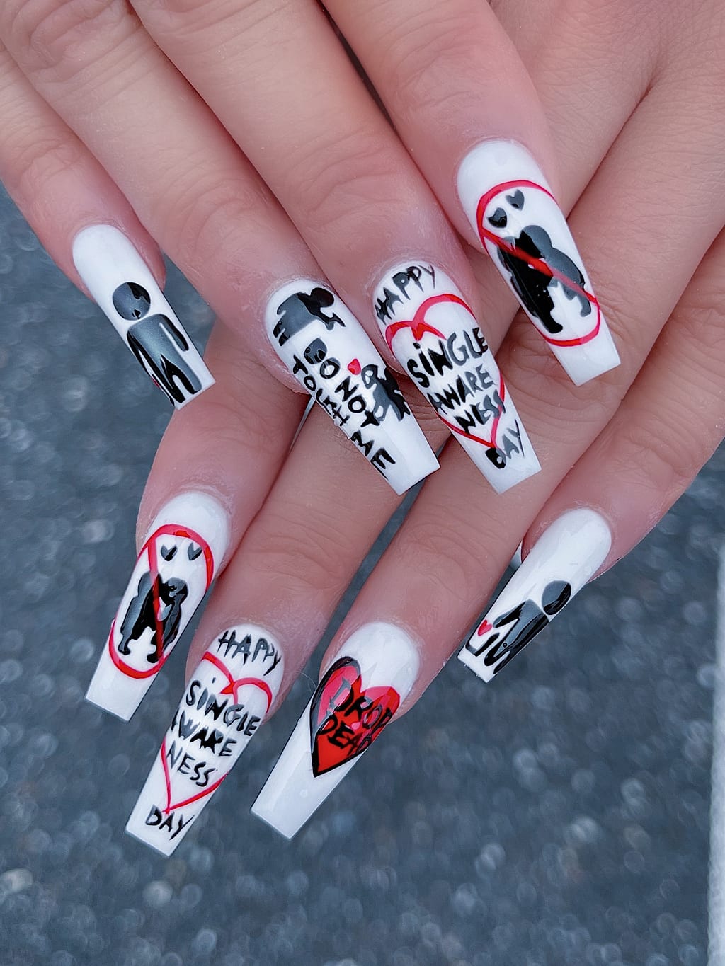 Coffin nails in black and white with skull faces at Palace Nail Spa in Midtown Tallahassee