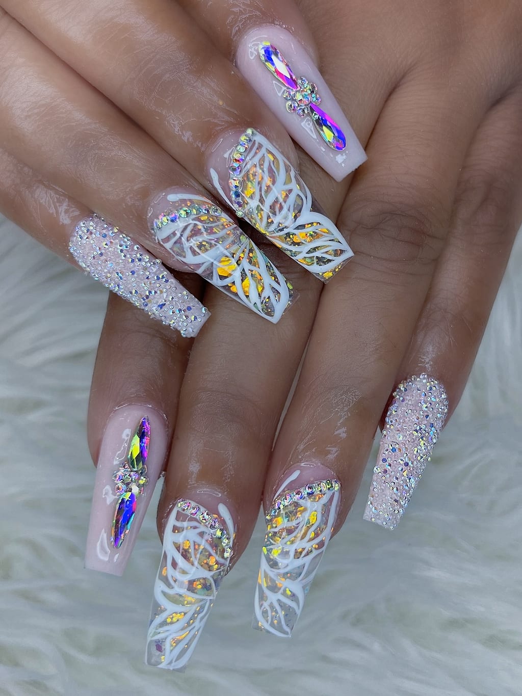 Hand-painted statement nail art at Palace Nail Spa in Midtown Tallahassee